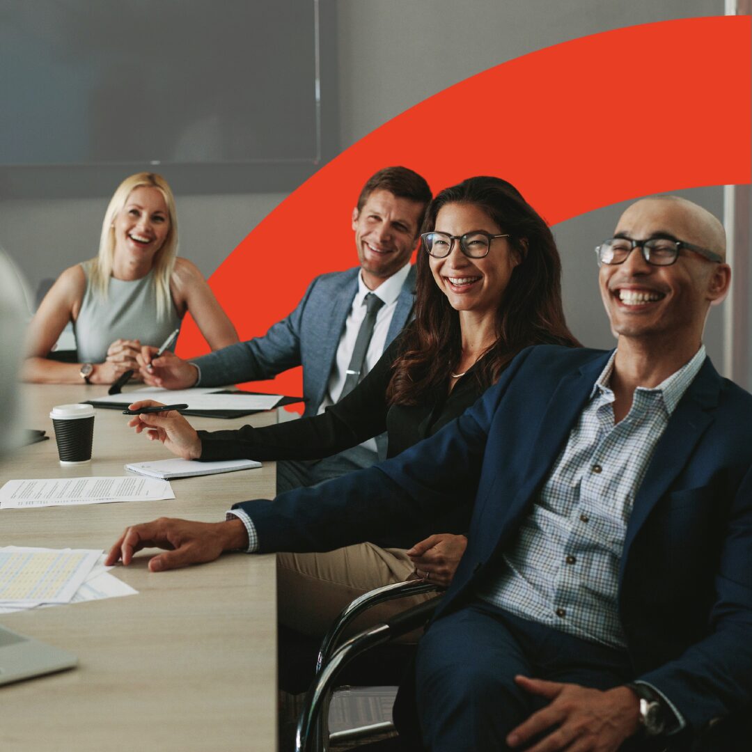 Image shows a diverse group of people at a table smiling. Image is intersected with a red arch.