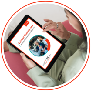 Photo shows a person reading the cultural diversity and cross-cultural communications guide on a tablet