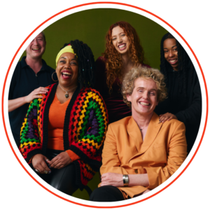 Photo shows diverse group of people posing and smiling for a photo